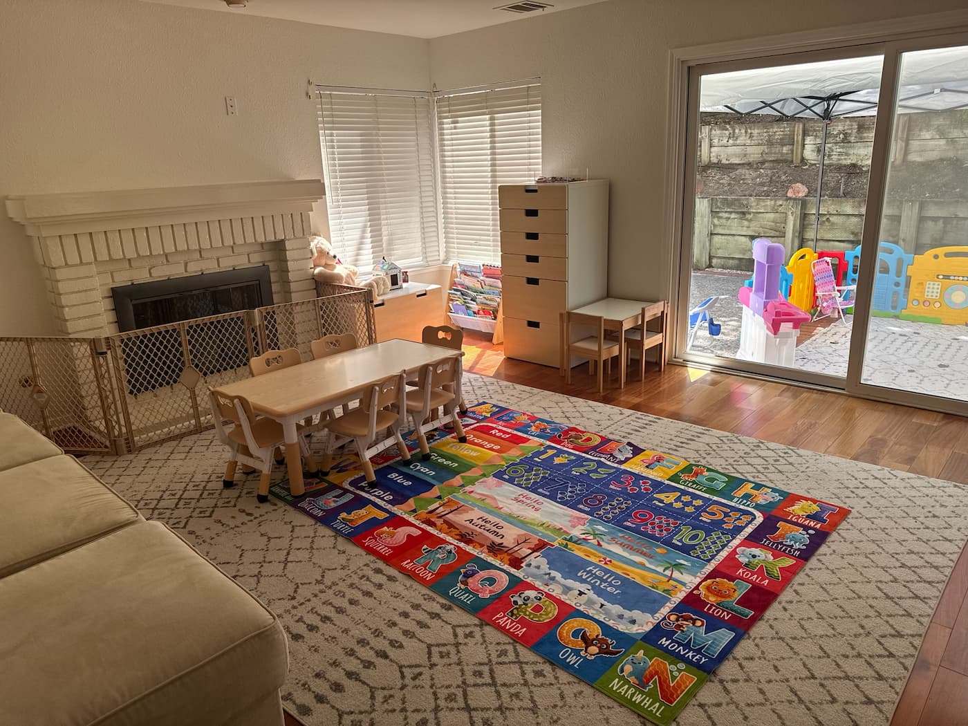 Our learning area: small table for circle time and structured activities, with a sliding door out to the protected outdoor play space