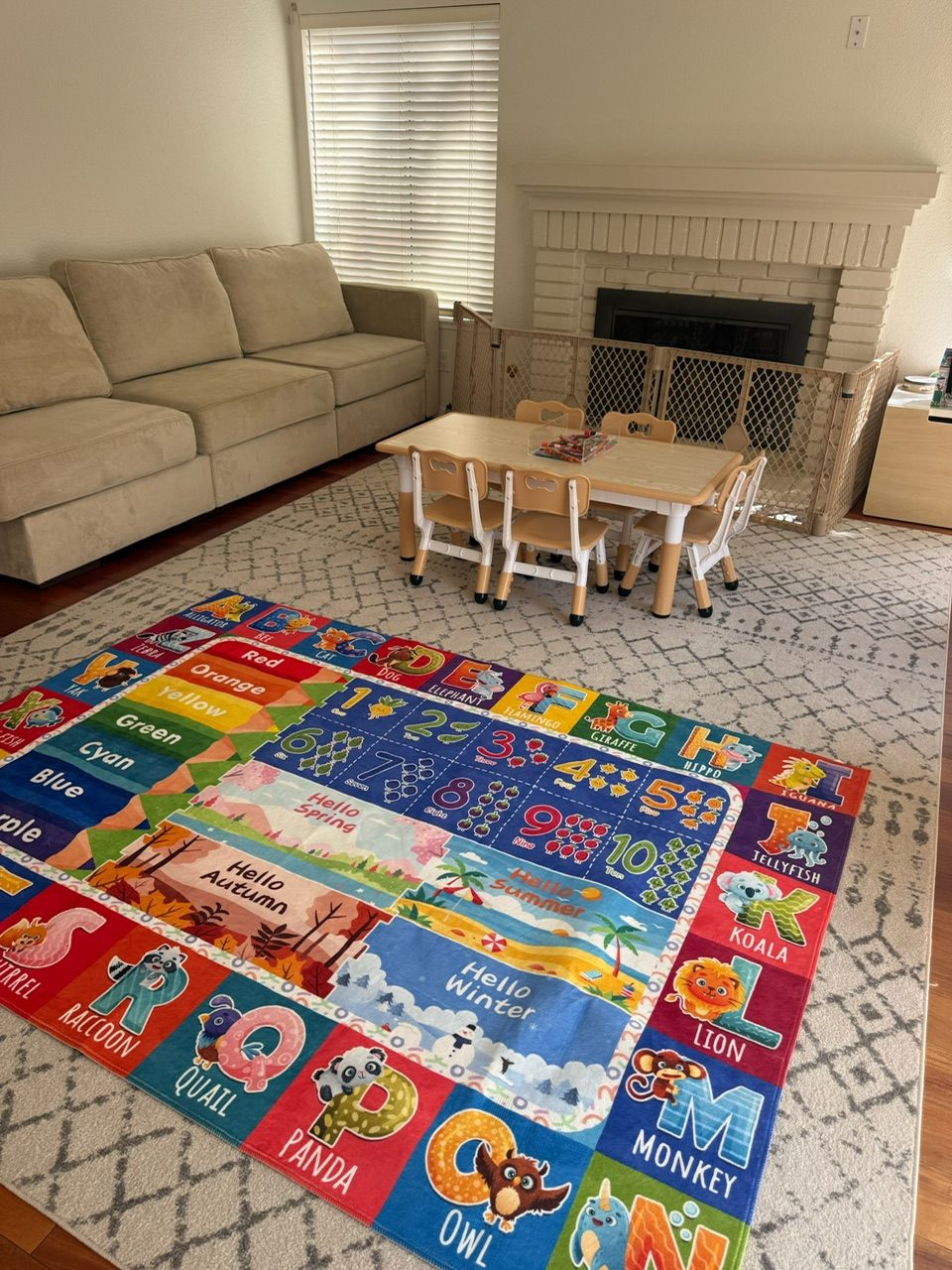 Our preschool learning space: child-size table and chairs with a learning rug